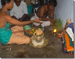 Mother's puja - offering camphor to picture of mother