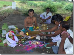 Offering camphor to altar