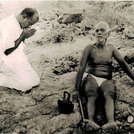 bhagavan-sitting-and-a-person-offering-his-respect